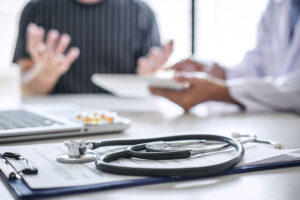 Patient meets doctor about health insurance